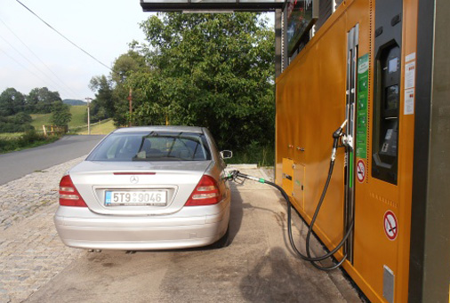 orange couch lamp and picture